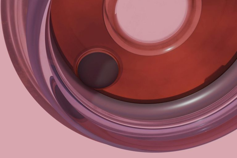 Modern abstract art showcasing smooth circular shapes in red and pink hues.